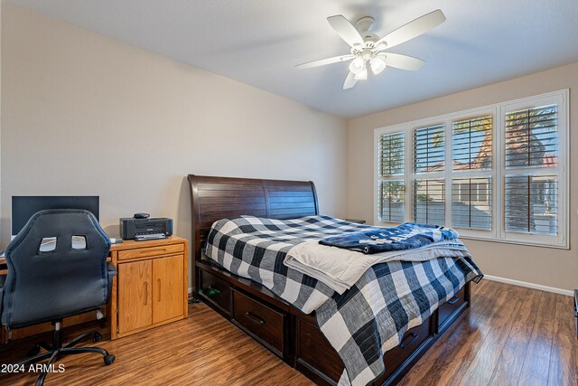 bedroom with hardwood / wood-style flooring and ceiling fan