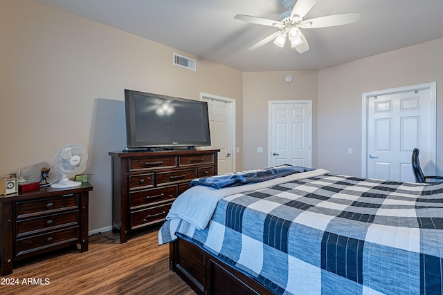 bedroom with ceiling fan and dark hardwood / wood-style floors