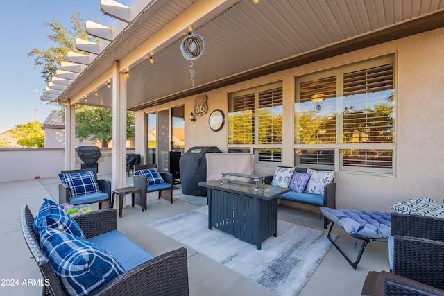 view of patio / terrace with an outdoor living space and a grill