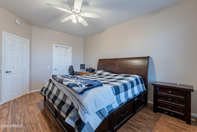 bedroom featuring ceiling fan and dark wood-type flooring