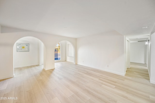 unfurnished room with light hardwood / wood-style floors