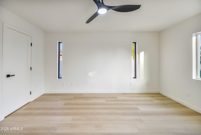 spare room featuring ceiling fan and light wood-type flooring