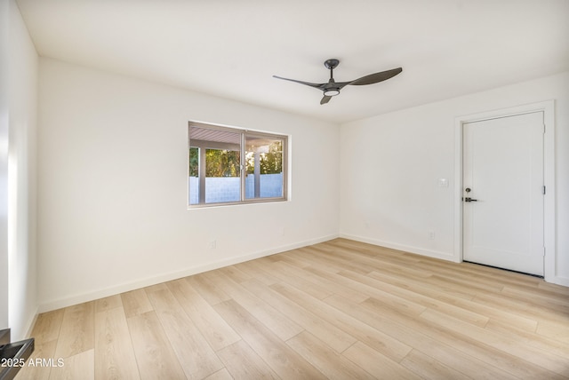 spare room with light hardwood / wood-style floors and ceiling fan