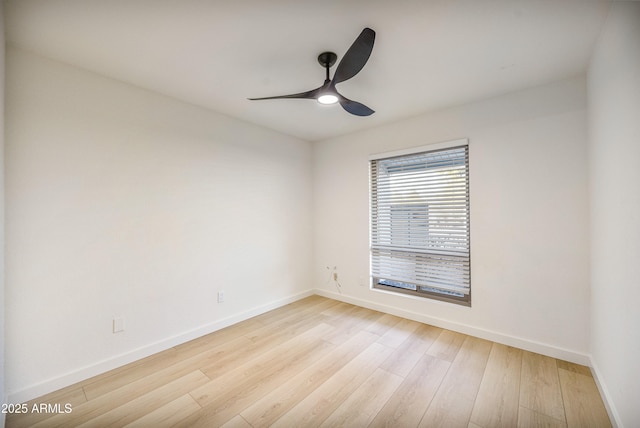 empty room with light hardwood / wood-style flooring and ceiling fan