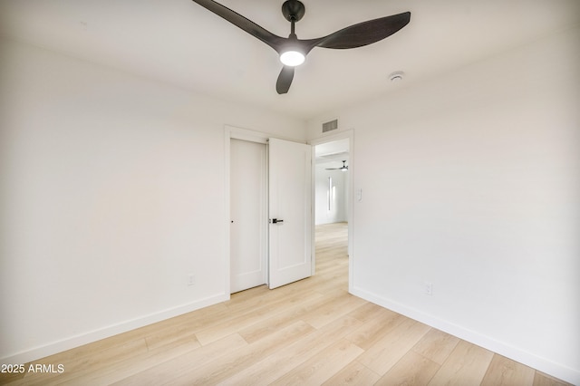 empty room with ceiling fan and light wood-type flooring