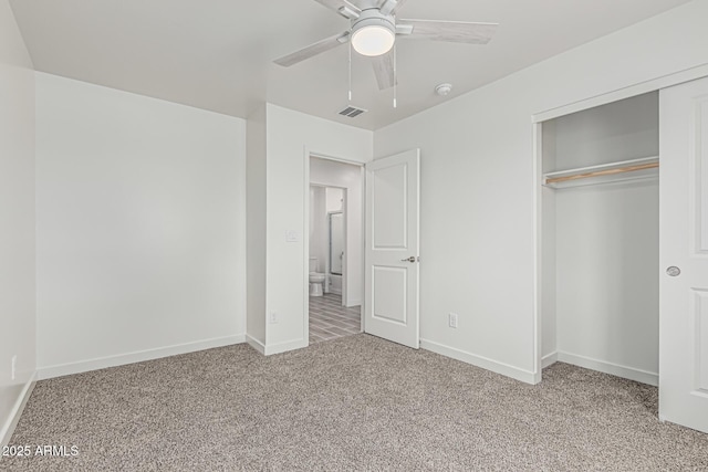 unfurnished bedroom featuring visible vents, a ceiling fan, a closet, baseboards, and light colored carpet