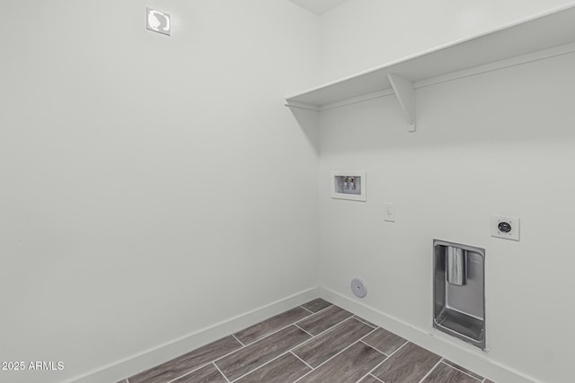 laundry area featuring laundry area, baseboards, electric dryer hookup, washer hookup, and wood finish floors