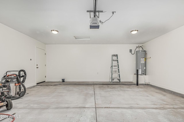 garage featuring baseboards, a garage door opener, and electric water heater