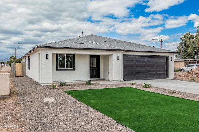 ranch-style home with a front lawn, stucco siding, an attached garage, driveway, and roof with shingles