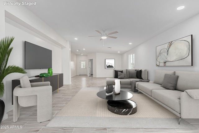 living area with baseboards, a ceiling fan, wood tiled floor, and recessed lighting