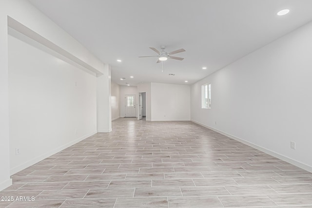 unfurnished room featuring ceiling fan, a wealth of natural light, and recessed lighting
