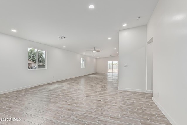 unfurnished room with light wood-style flooring, baseboards, visible vents, recessed lighting, and a ceiling fan