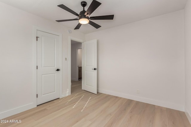 unfurnished bedroom featuring ceiling fan and light hardwood / wood-style flooring