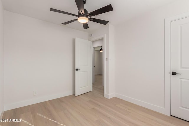 unfurnished bedroom with ceiling fan and light hardwood / wood-style flooring