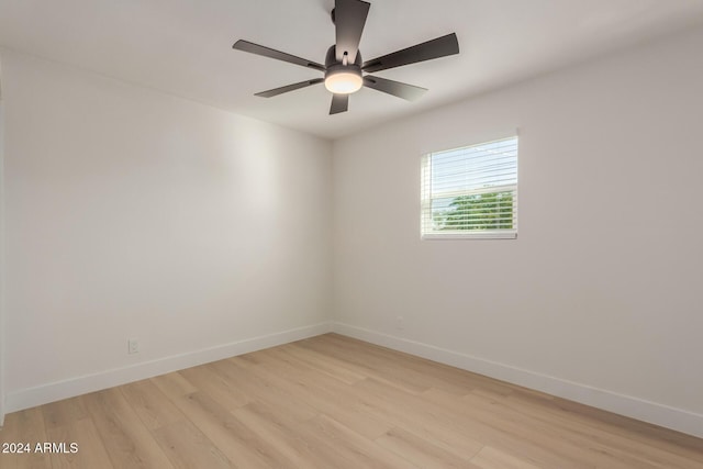 spare room with ceiling fan and light hardwood / wood-style flooring