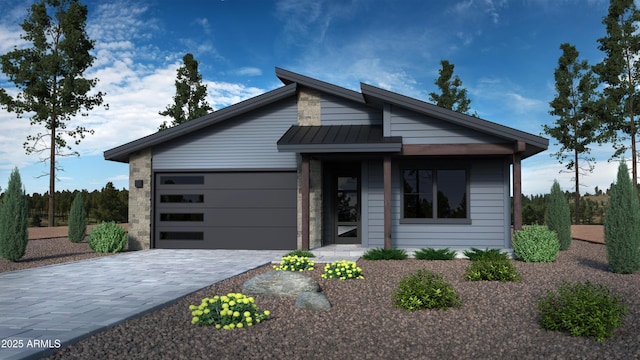 view of front of house featuring decorative driveway, a standing seam roof, metal roof, and a garage