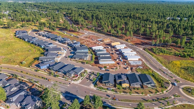 aerial view with a residential view and a view of trees