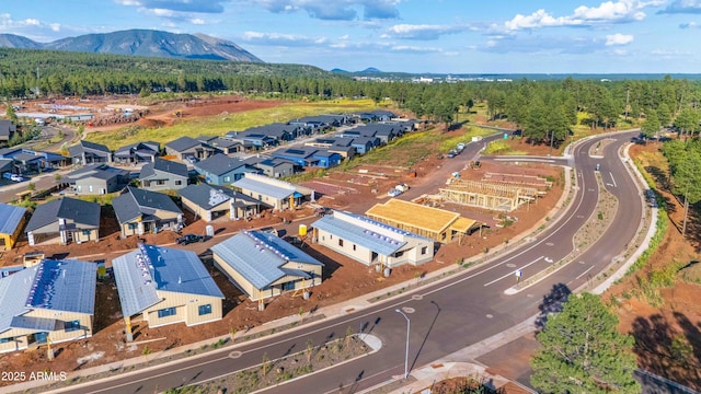 bird's eye view featuring a forest view, a residential view, and a mountain view