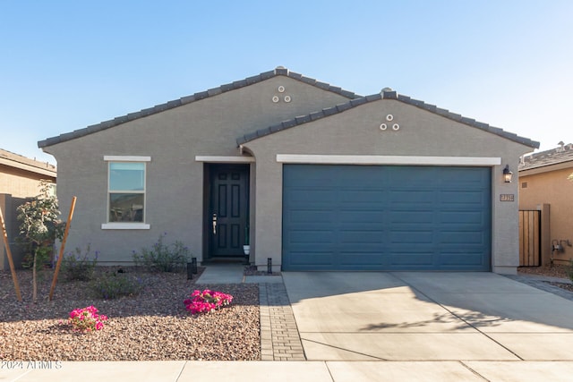 ranch-style home with a garage