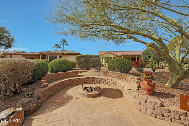 view of patio featuring a fire pit