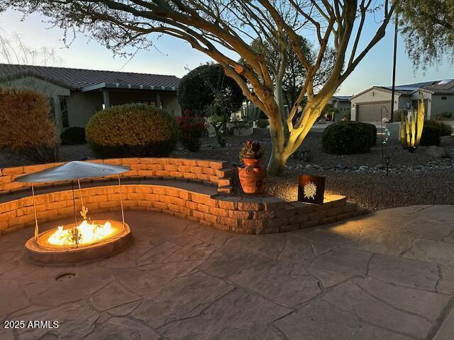 view of patio featuring an outdoor fire pit