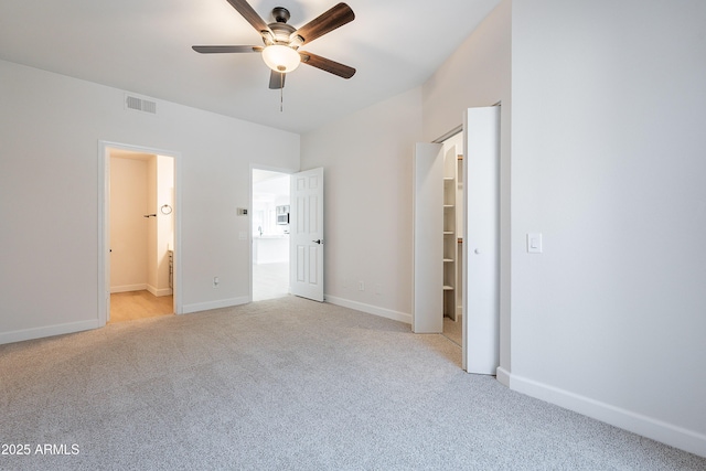 101 N 7th St Unit 168, Phoenix, AZ 85034 - unfurnished bedroom with light colored carpet, ensuite bath, and a ceiling fan