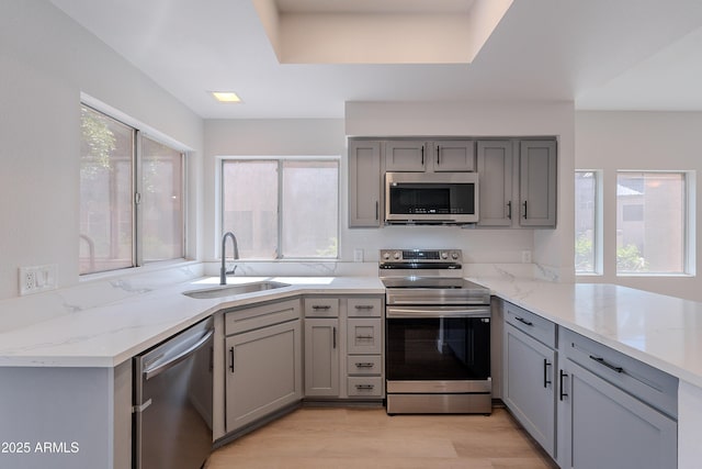 101 N 7th St Unit 168, Phoenix, AZ 85034 - kitchen with stainless steel appliances, gray cabinets, and healthy amount of natural light