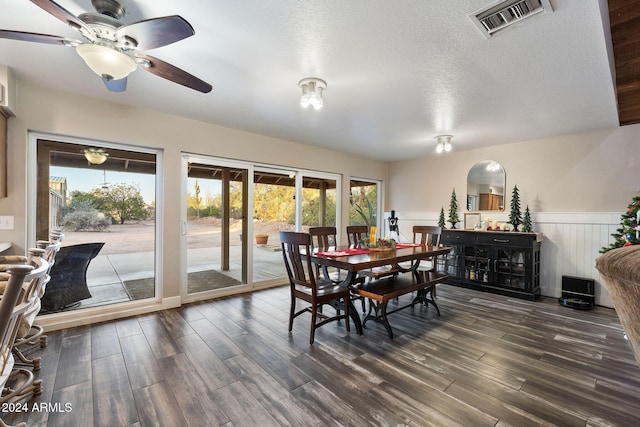 dining space with ceiling fan, a healthy amount of sunlight, and a textured ceiling