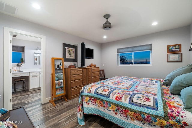 bedroom featuring ensuite bath, ceiling fan, and wood-type flooring