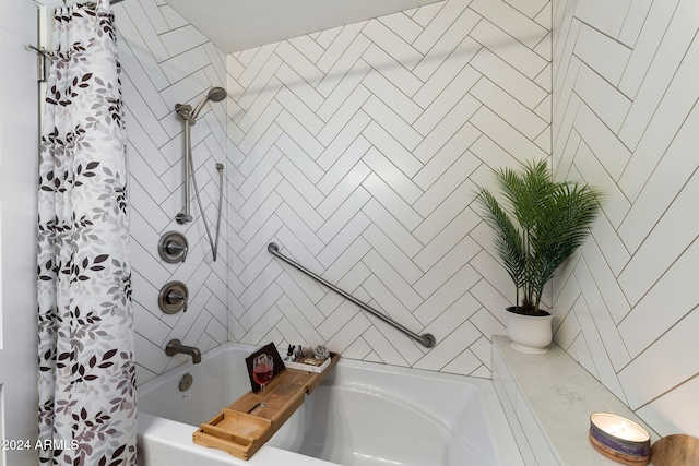 bathroom featuring shower / bath combo with shower curtain