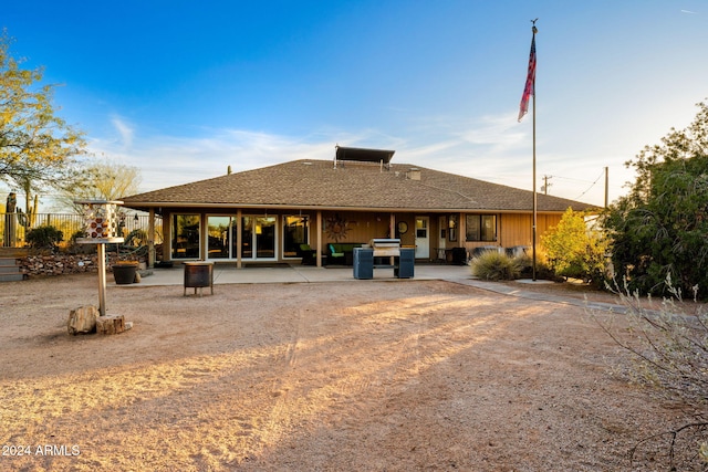 rear view of property featuring a patio area