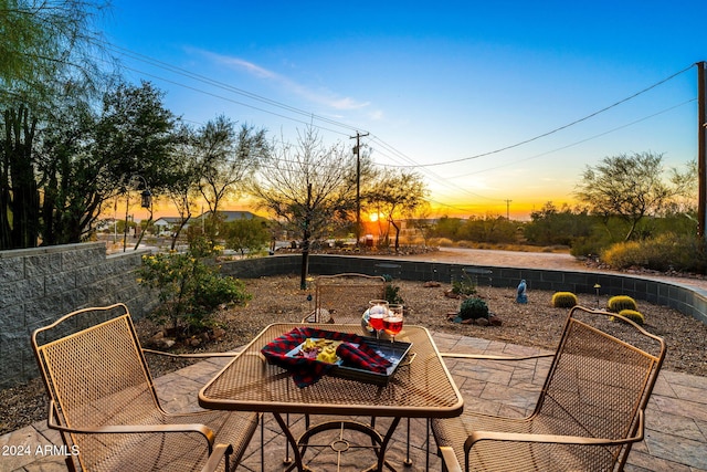 view of patio terrace at dusk