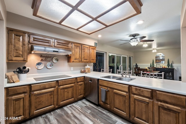 kitchen with dishwasher, black electric stovetop, sink, hardwood / wood-style flooring, and kitchen peninsula