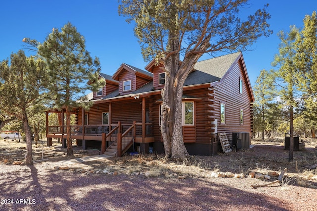 exterior space featuring a wooden deck