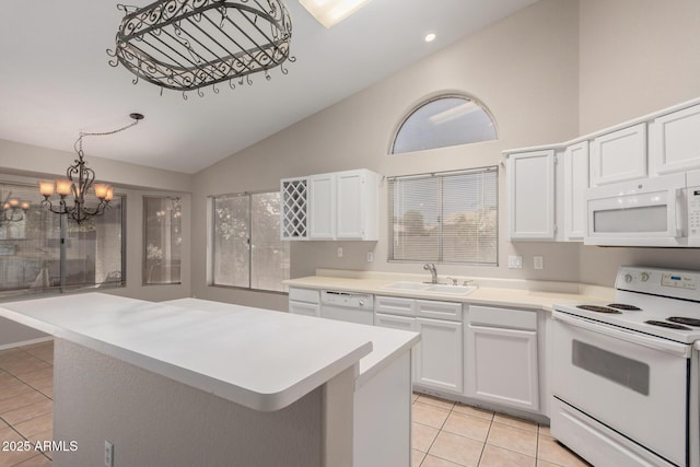 1915 E Golden Ct, Chandler, AZ 85225 - kitchen featuring white appliances, a sink, a kitchen island, and light tile patterned flooring