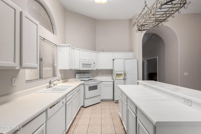 1915 E Golden Ct, Chandler, AZ 85225 - kitchen with light tile patterned floors, a sink, white appliances, and light countertops