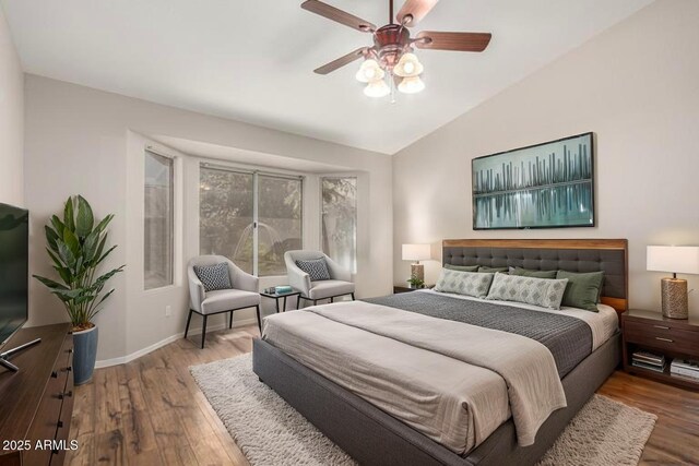 1915 E Golden Ct, Chandler, AZ 85225 - bedroom with wood finished floors, lofted ceiling, baseboards, and a ceiling fan