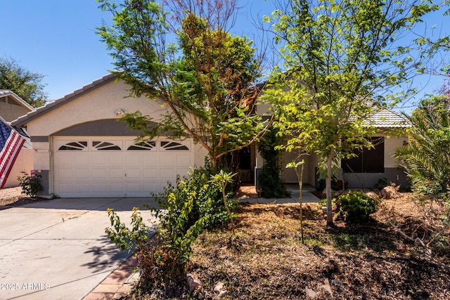 1915 E Golden Ct, Chandler, AZ 85225 - view of property hidden behind natural elements featuring stucco siding, an attached garage, driveway, and a tiled roof