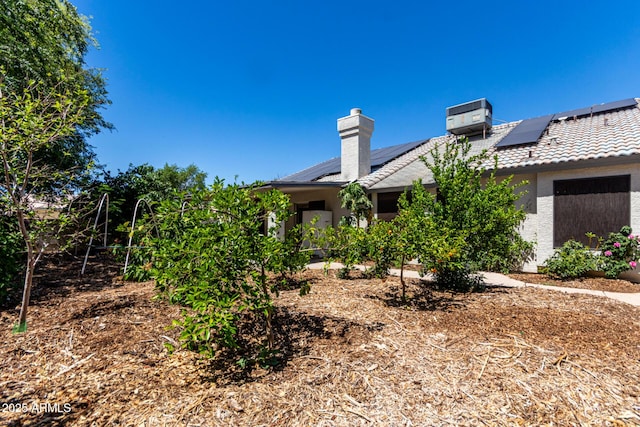 1915 E Golden Ct, Chandler, AZ 85225 - exterior space featuring stucco siding, roof mounted solar panels, central AC unit, and a tile roof