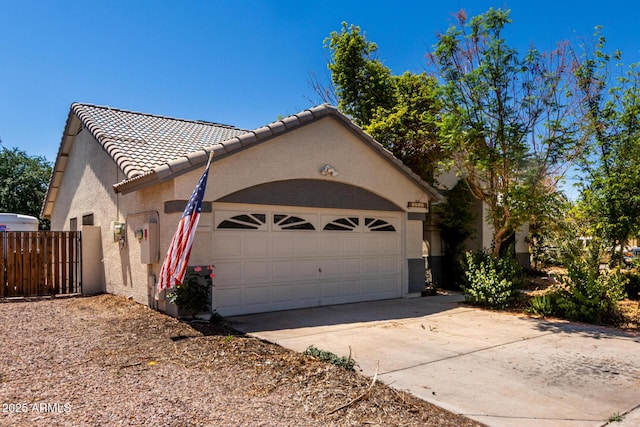 1915 E Golden Ct, Chandler, AZ 85225 - view of property exterior with a tile roof, driveway, fence, a garage, and stucco siding