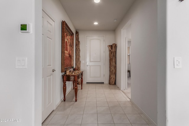 hallway featuring light tile patterned floors