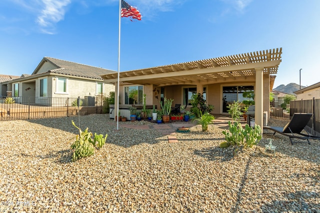 rear view of property featuring a patio