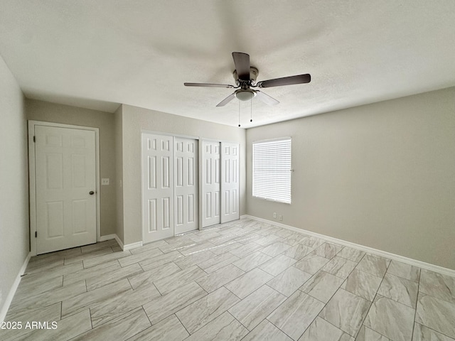 unfurnished bedroom with ceiling fan