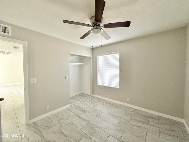 unfurnished bedroom with a closet and ceiling fan