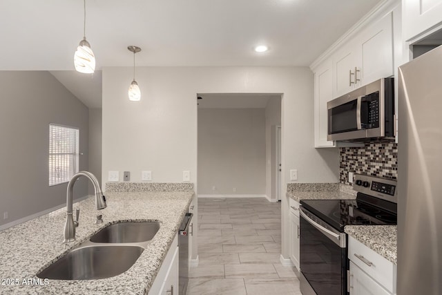 kitchen with sink, white cabinetry, pendant lighting, stainless steel appliances, and light stone countertops