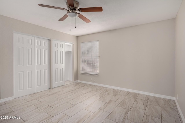 unfurnished bedroom featuring ceiling fan