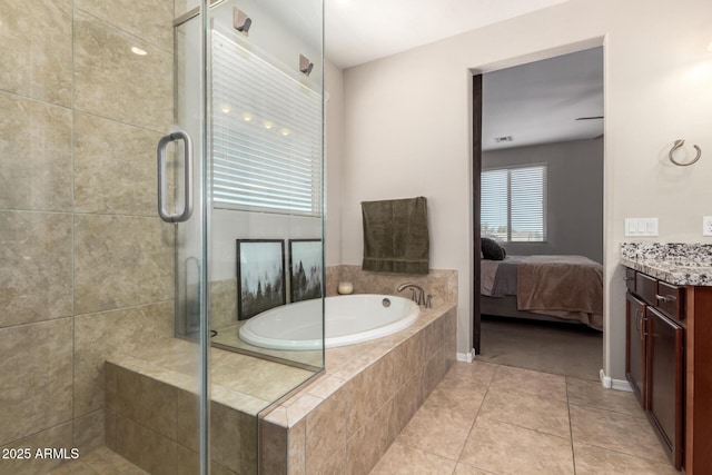 10221 E Wavelength Ave, Mesa, AZ 85212 - ensuite bathroom with vanity, a shower stall, a garden tub, and tile patterned floors