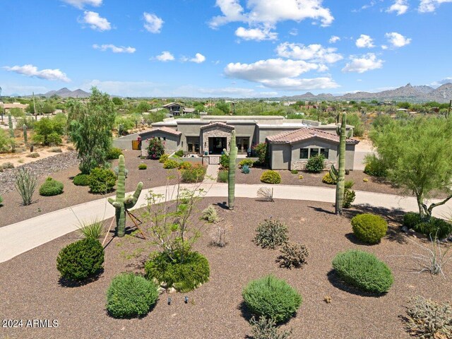 view of patio / terrace featuring a mountain view and an outdoor fire pit