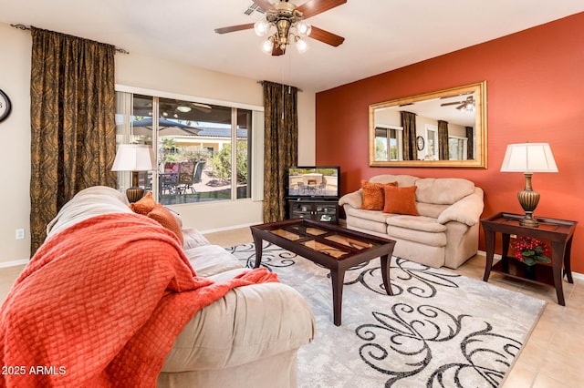 living room featuring light tile patterned floors and ceiling fan