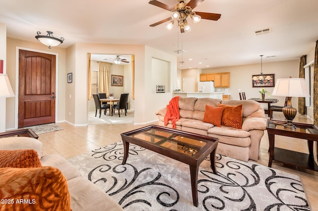 tiled living room featuring ceiling fan